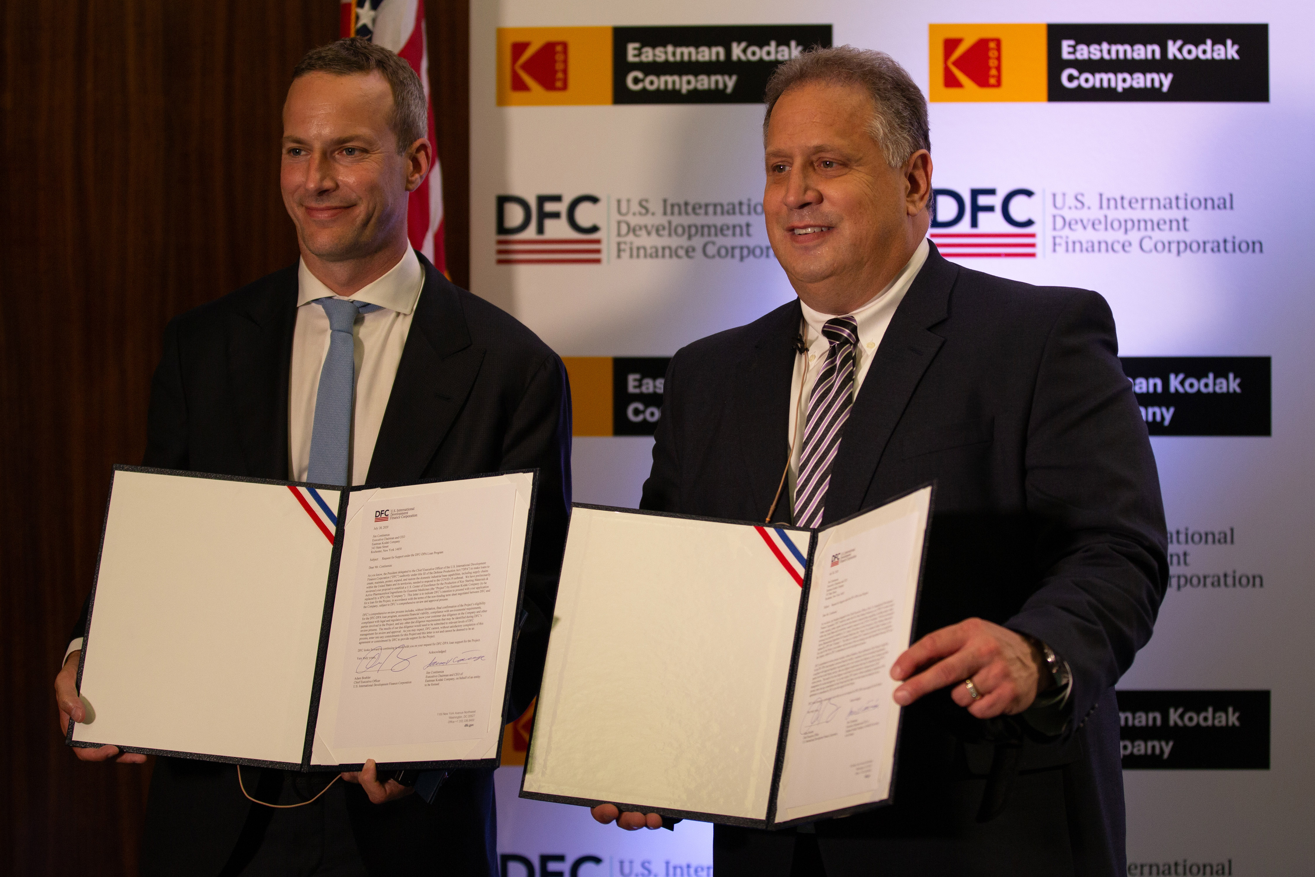 photo, DFC CEO Adam Boehler and Kodak Executive Chairman Jim Continenza display signed letters of interest