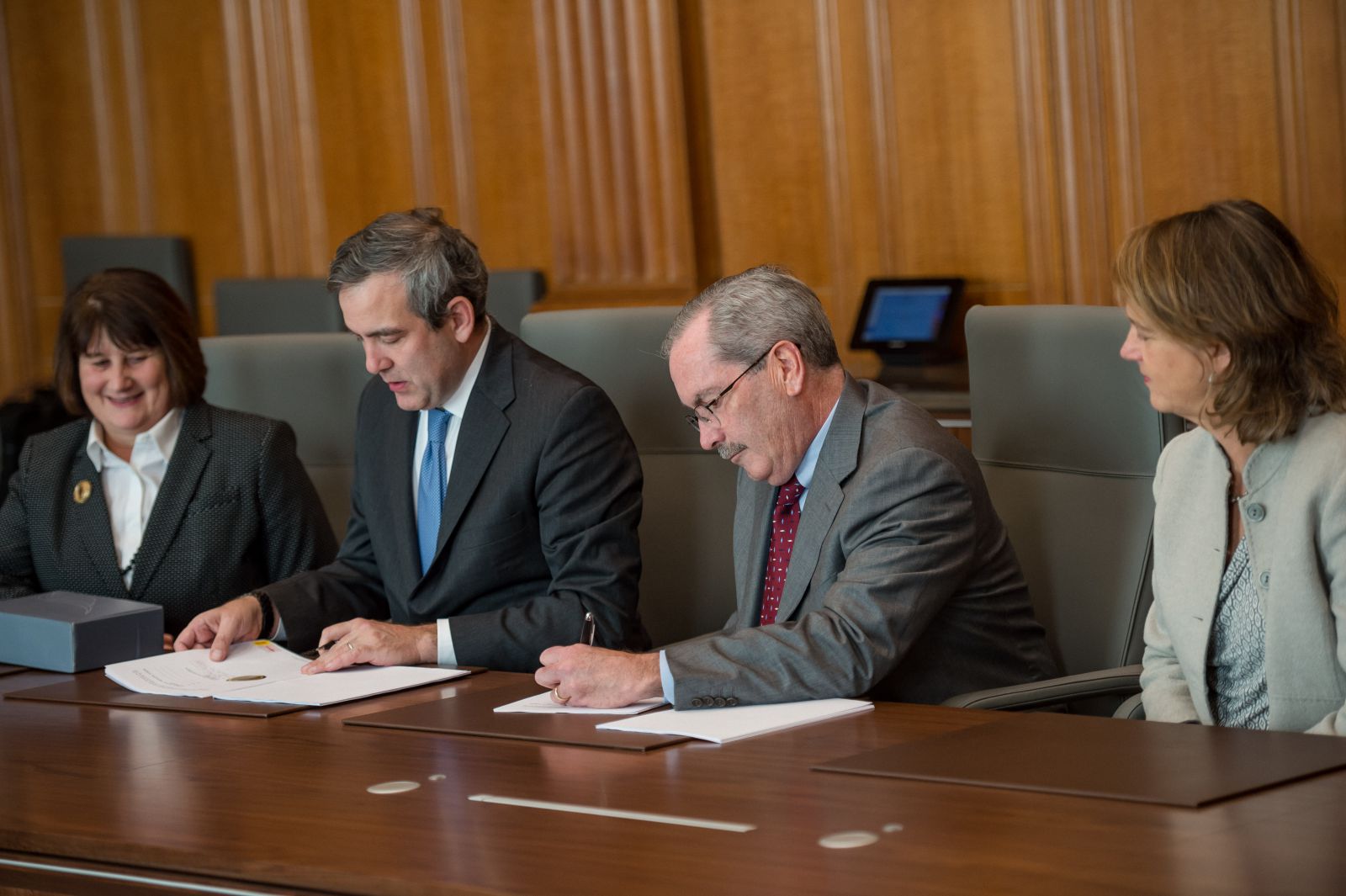 photo OPIC Overseas Private Investment Corporation and Liberty Mutual sign agreement