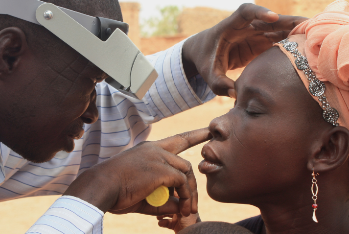 Ophthalmologist examining a patient's eyes