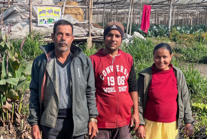 Nepalese farmers standing in a field
