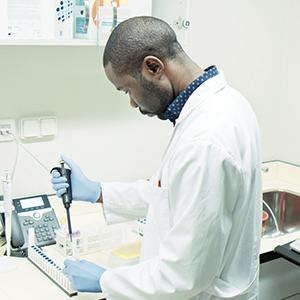 photo, man working in a lab in Luanda