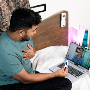 Indian man on a video call with a doctor