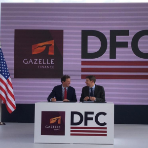 DFC CEO at signing ceremony