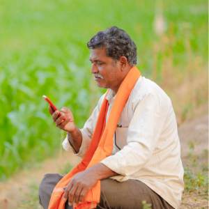 Indian farmer using mobile phone